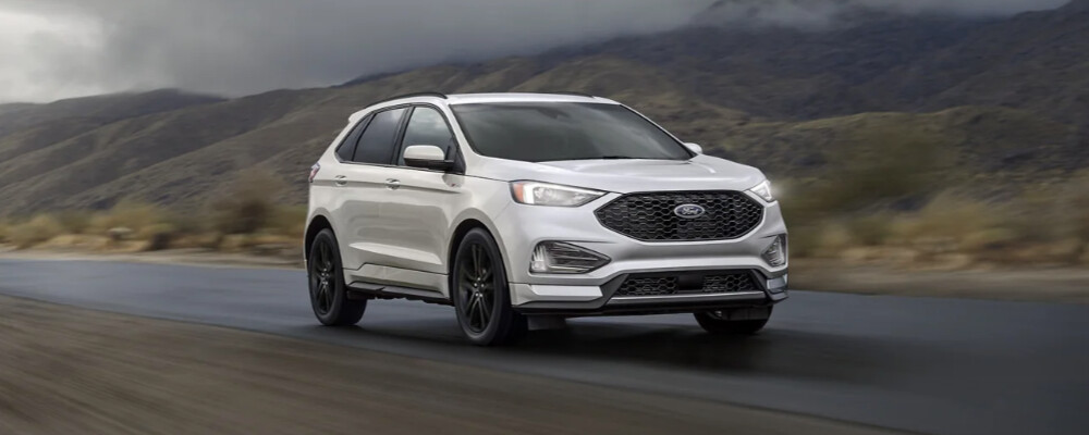 a 2023 Ford Edge driving down the road