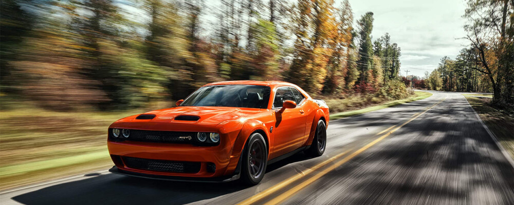 2023 Dodge Challenger driving through the forest