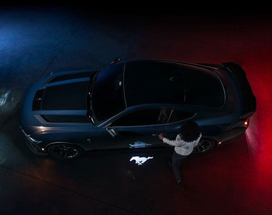 2024 Ford Mustang® Dark Horse™ model with a driver approaching the vehicle | Al Packer Ford Royal Palm Beach in Royal Palm Beach FL